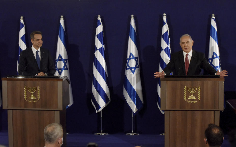 Israeli Prime Minister Benjamin Netanyahu, right, and Greek Prime Minister Kyriakos Mitsotakis give joint statements in Jerusalem, Tuesday, June 16, 2020. (Debbie Hill, UPI Pool via AP)