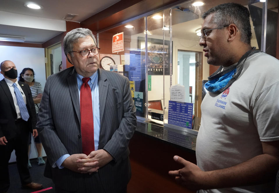 In this Aug. 18, 2020, photo Attorney General William Barr speaks with employees at the JZ Motel in Detroit, about their participation in crime prevention programs. (AP Photo/Mike Balsamo)