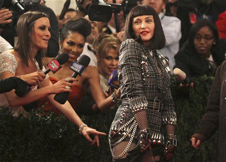 Singer Madonna arrives at the Metropolitan Museum of Art Costume Institute Benefit celebrating the opening of "PUNK: Chaos to Couture" in New York, in this May 6, 2013 file photo.REUTERS/Carlo Allegri/Files