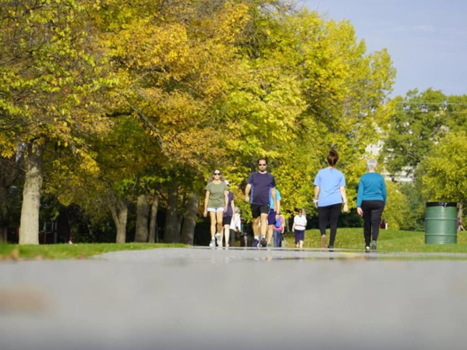 People exercise on a path through Britannia Park in Ottawa on Oct. 20, 2021.  (Hugo Belanger/CBC - image credit)
