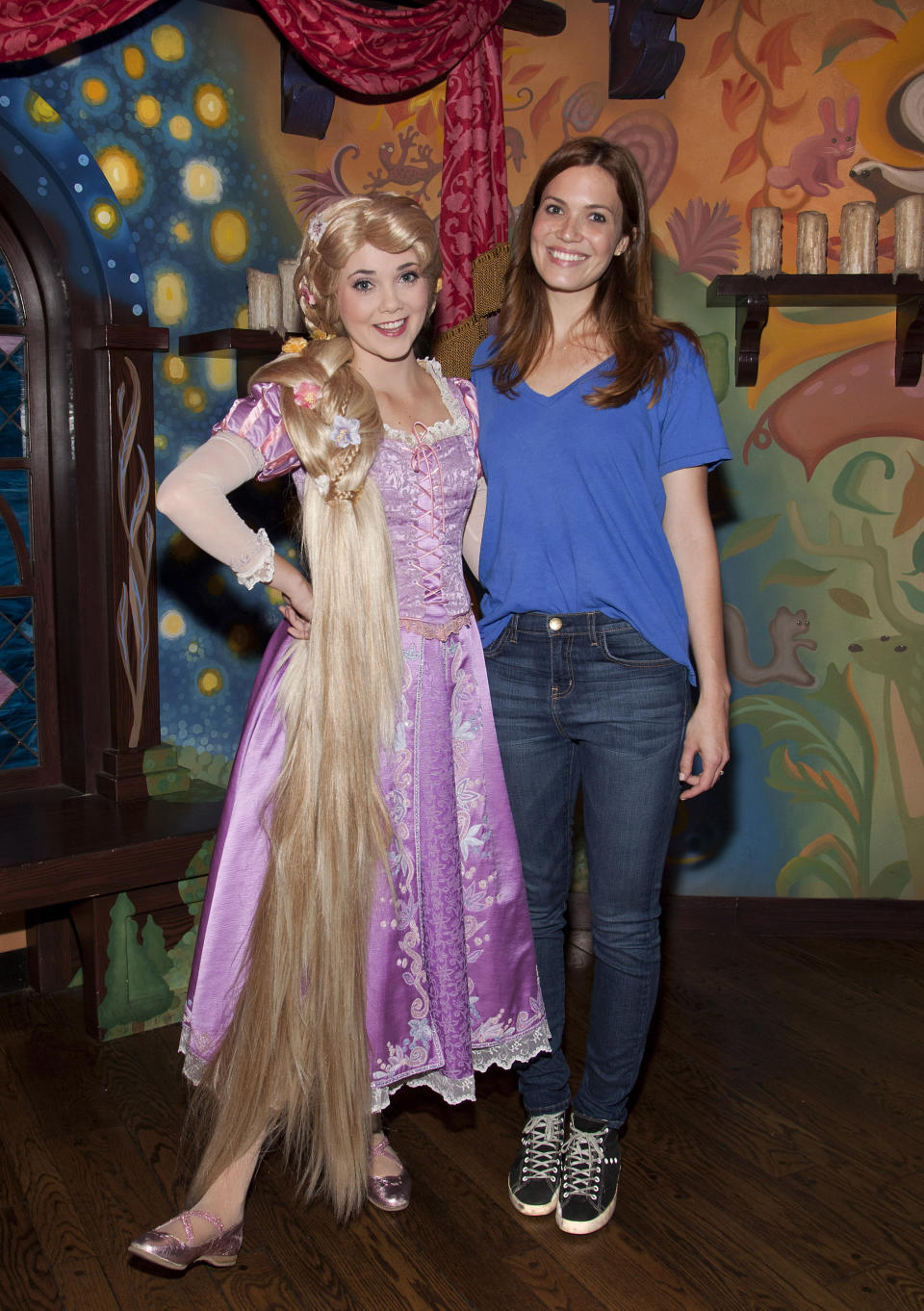 Singer/actress Mandy Moore poses with Rapunzel at Disneyland Park October 15, 2012 in Anaheim, California.  (Photo by Paul Hiffmeyer/Disney Parks via Getty Images)