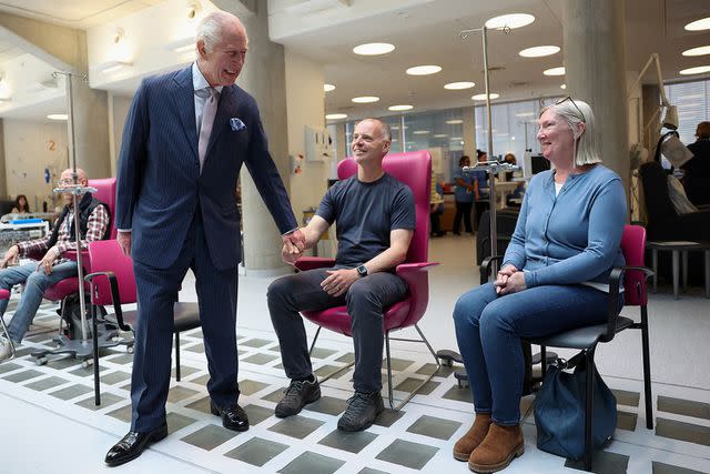 <p>SUZANNE PLUNKETT/POOL/AFP via Getty Images</p> King Charles (left) visits the University College Hospital Macmillan Cancer Centre in London on April 30, 2024
