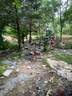 Debris from a homeless encampment was cleared from a county-owned property behind the westside At Home store.