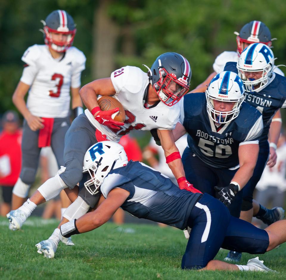 Rootstown hosted Crestwood for their football home opener. Drew Nero aims for the legs of Nate Blasiole on the run.