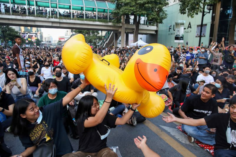 Pro-democracy demonstrators move an inflatable rubber duck during a rally in Bangkok