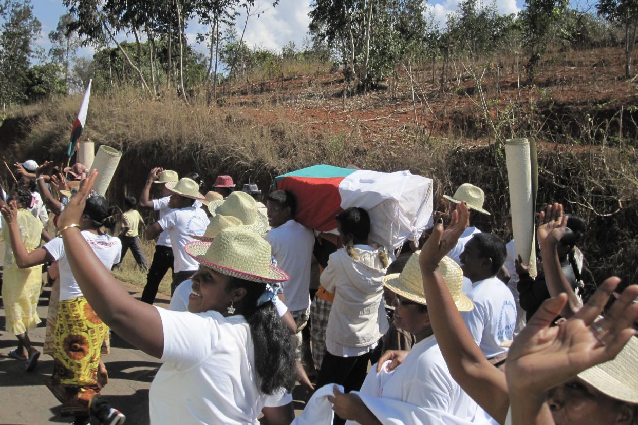 Famadihana translates to “turning of the bones” and involves people carrying the bodies of their loved ones out of the crypts and rewrapping them in fresh cloth.