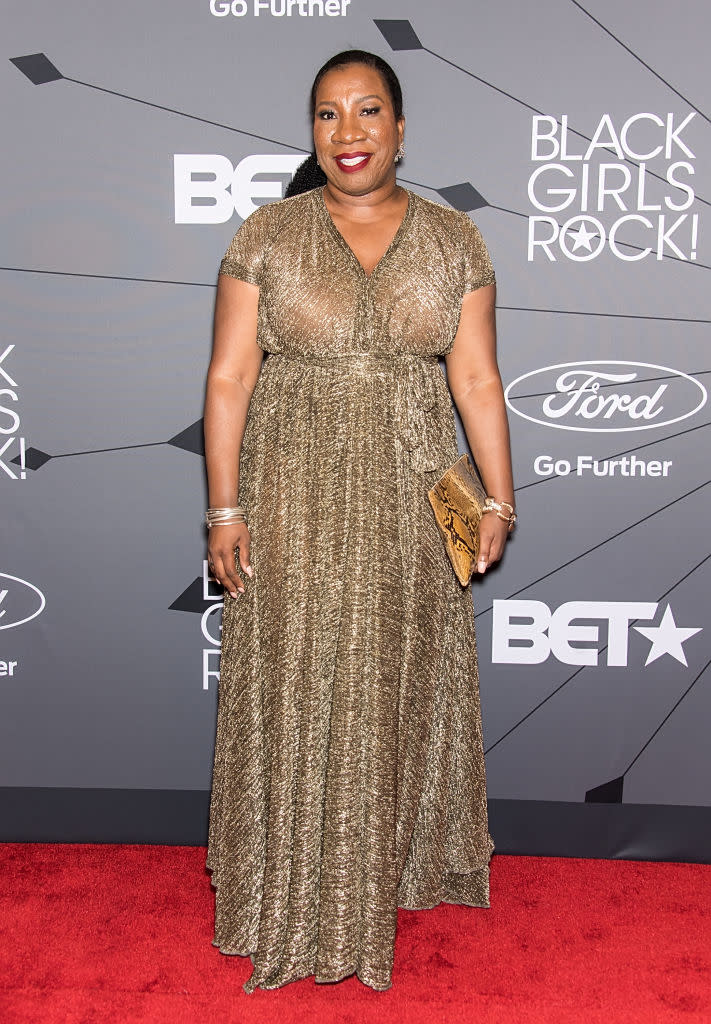 #MeToo founder Tarana Burke wears a gold shimmery maxi gown while sporting a snakeskin clutch and gold accessories at the Black Girls Rock awards show on Aug. 26 in Newark, New Jersey. (Photo by Gilbert Carrasquillo/WireImage)