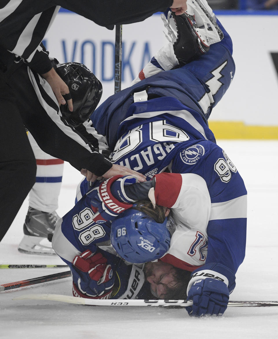 Tampa Bay Lightning defenseman Mikhail Sergachev checks Montreal Canadiens right wing Brendan Gallagher (11) on the ice during the third period in Game 1 of the NHL hockey Stanley Cup finals, Monday, June 28, 2021, in Tampa, Fla. (AP Photo/Phelan Ebenhack)