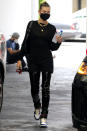 <p>Hailey Bieber is dressed in all-black with a color coordinated mask during an outing in Beverly Hills on Friday.</p>