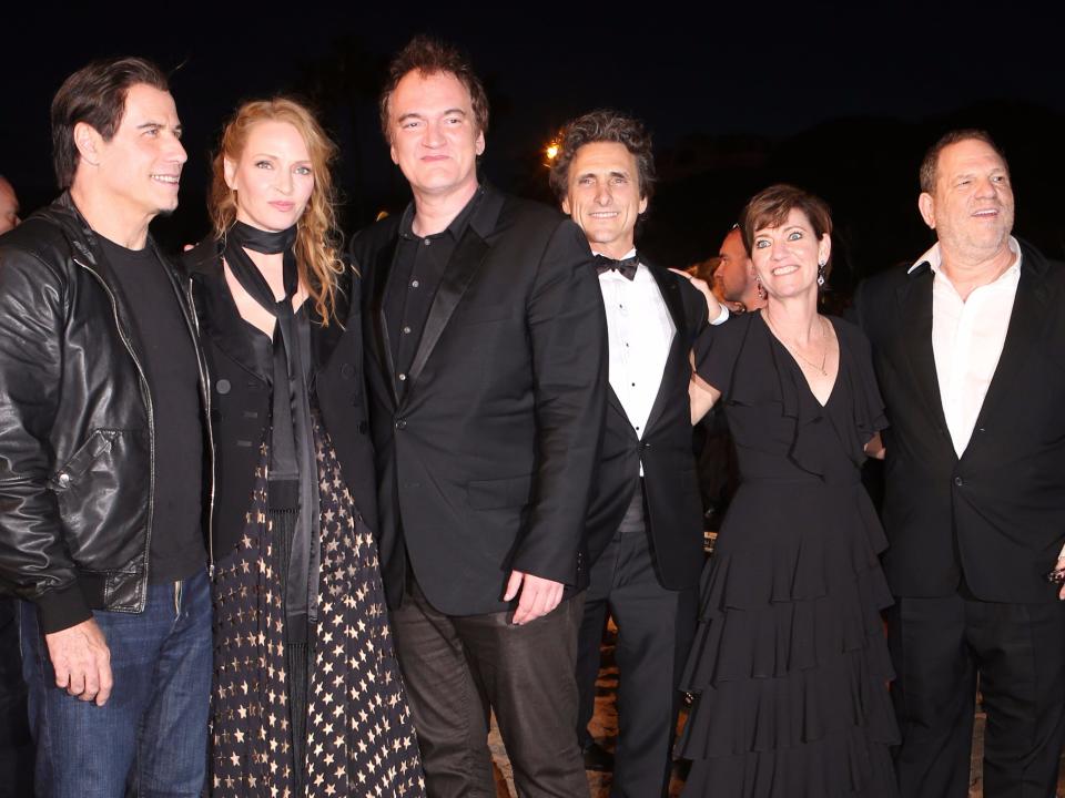 John Travolta, Uma Thurman, Quentin Tarantino Lawrence Bender, Harvey Weinstein and Zanne Devine pose together ahead of the beach screening of Pulp Fiction at Miramax's 20th Anniversary celebration of the film at Majestic Beach in Cannes, southern France, during the 67th international film festival, Friday, May 23, 2014.