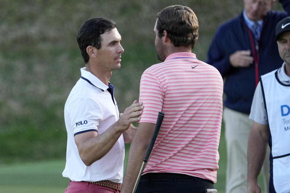 Billy Horschel, left, is congratulated by Scottie Scheffler after Horschel won the Dell Technologies Match Play Championship golf tournament Sunday, March 28, 2021, in Austin, Texas. (AP Photo/David J. Phillip)