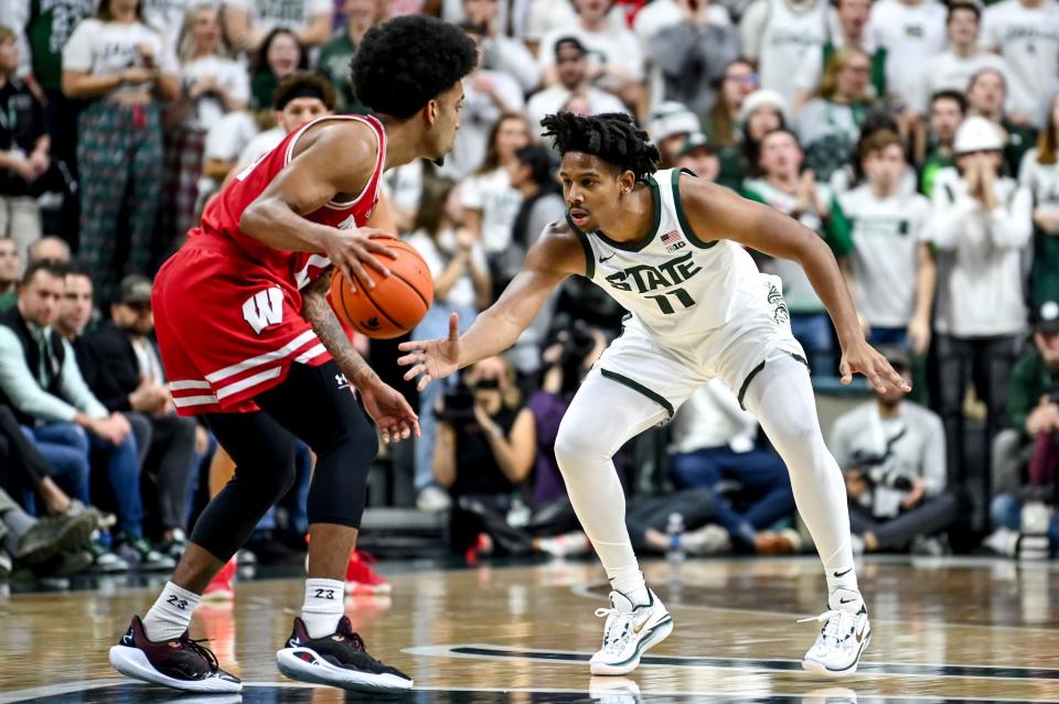 Michigan State's A.J. Hoggard, right, guards Wisconsin's Chucky Hepburn during the first half on Tuesday, Dec. 5, 2023, at the Breslin Center in East Lansing.