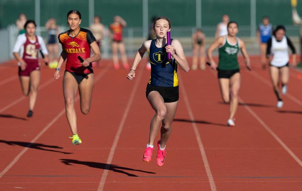 Turlock’s Shaylan Roy-Williams runs the final leg of the 4x100 race during the Stanislaus County track meet at Hughson High School in Hughson, Calif., Friday, March 24, 2023. Turlock won the race with a time of 49.80. Oakdale was second at 50.65.