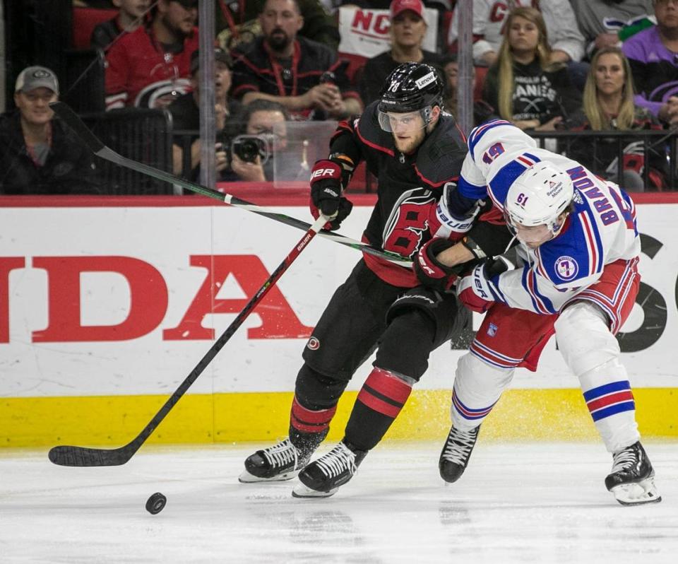 Carolina Hurricanes Steven Lorentz (78) battles with New York Rangers Justin Braun (61) in the third period on Friday, May 20, 2022 during game two of the Stanley Cup second round at PNC Arena in Raleigh, N.C.