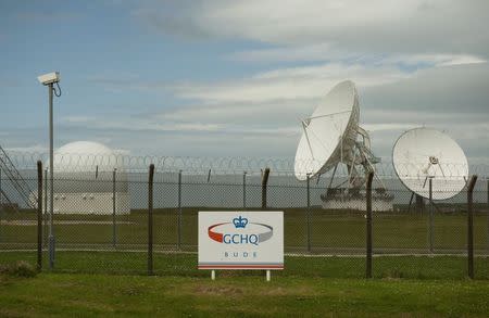 Satellite dishes are seen at GCHQ's outpost at Bude, close to where trans-Atlantic fibre-optic cables come ashore in Cornwall, southwest England in this file photograph dated June 23, 2013. REUTERS/Kieran Doherty/files