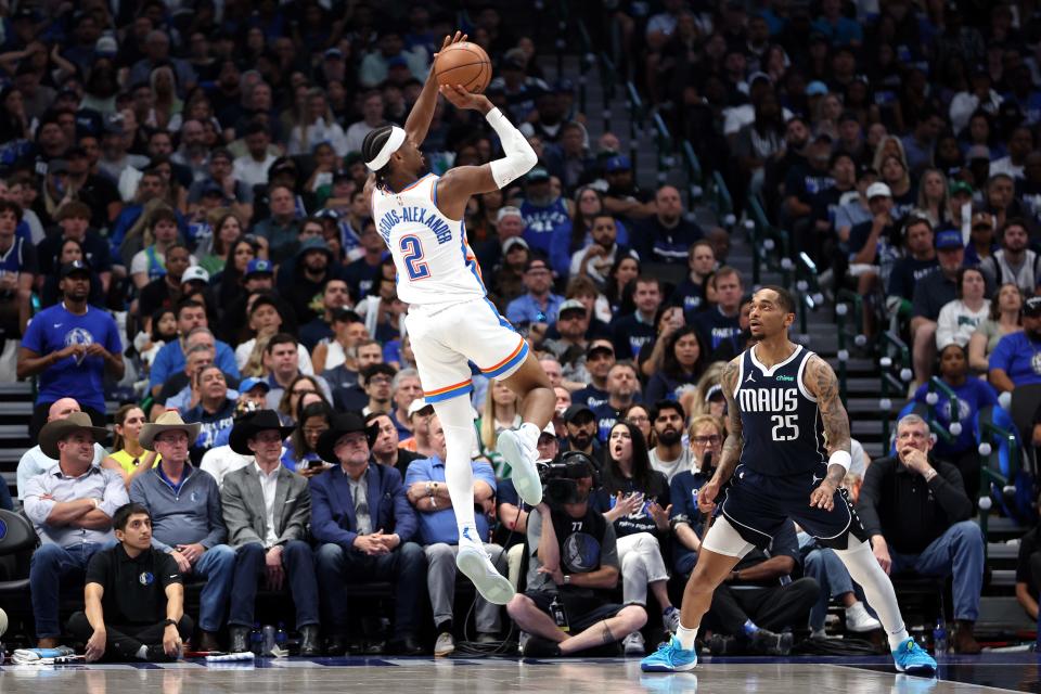 DALLAS, TEXAS - MAY 11: Shai Gilgeous-Alexander #2 of the Oklahoma City Thunder shoots over P.J. Washington #25 of the Dallas Mavericks during the third quarter in Game Three of the Western Conference Second Round Playoffs at American Airlines Center on May 11, 2024 in Dallas, Texas. NOTE TO USER: User expressly acknowledges and agrees that, by downloading and or using this photograph, User is consenting to the terms and conditions of the Getty Images License Agreement. (Photo by Tim Heitman/Getty Images)