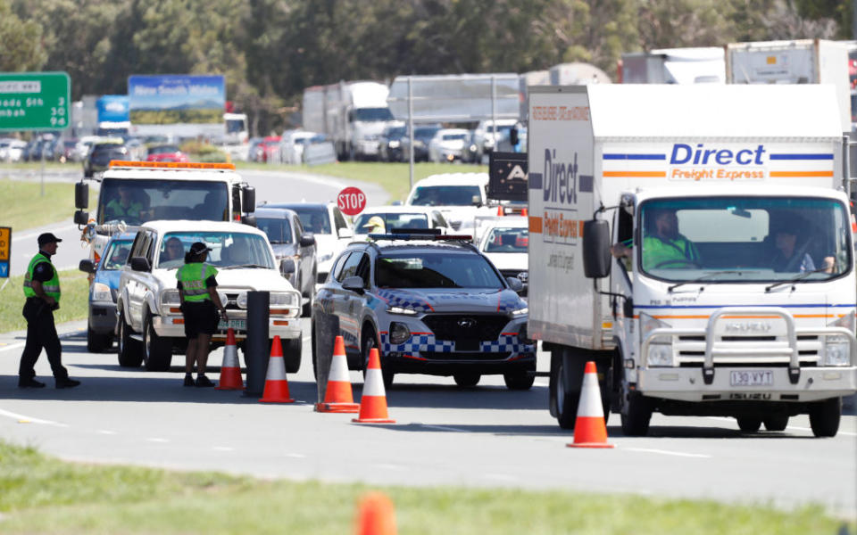 Long queue of motorists who are entering Queensland from New South Wales through the border checkpoint in Coolangatta, Gold Coast, Australia. 