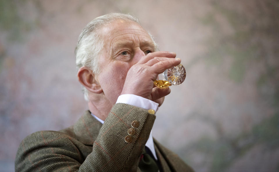 The Prince of Wales takes part in a whisky tasting during a visit to the Royal Lochnagar Distillery at Crathie on Royal Deeside (PA)