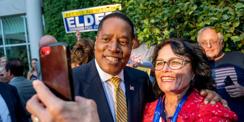 California governor recall candidate Larry Elder takes a selfie with a supporter outside of the Warner Center Marriott Woodland Hills in Woodland Hills CA., Tuesday, August 24, 2021.