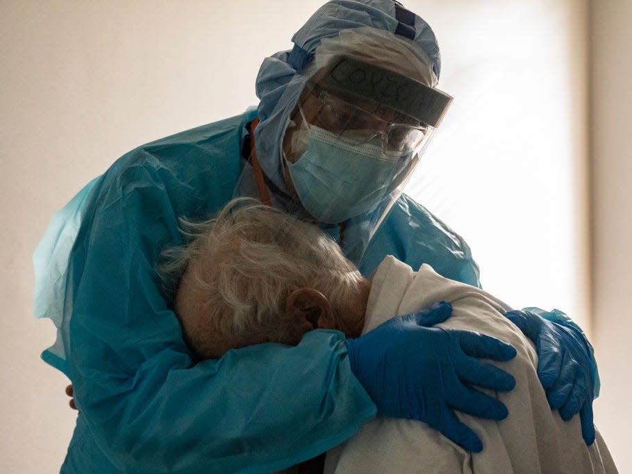 Dr. Joseph Varon hugs and comforts a patient in the COVID-19 intensive care unit (ICU) during Thanksgiving at the United Memorial Medical Center on November 26, 2020 in Houston, Texas.