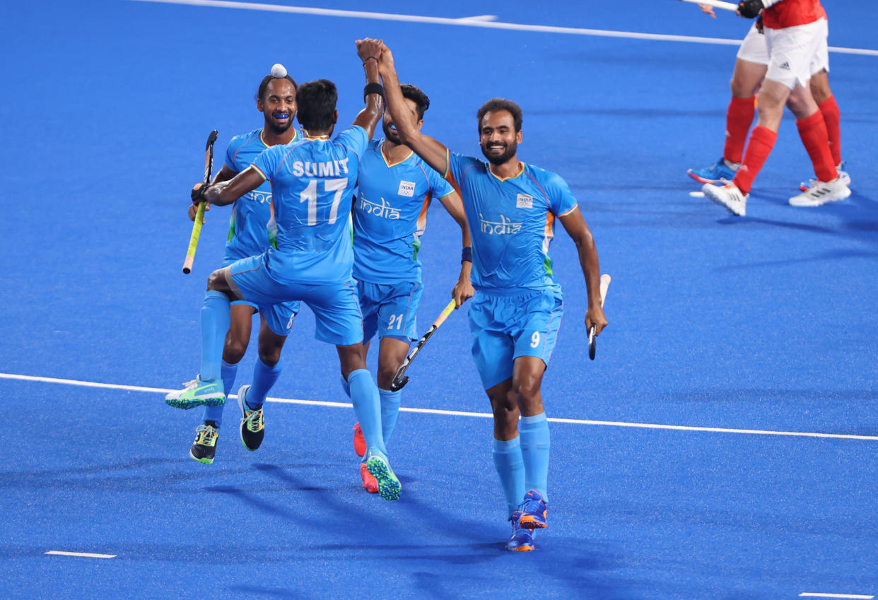 TOKYO, JAPAN - AUGUST 01: Gurjant Singh of Team India celebrates with teammates Sumit, Hardik Singh and Shamsher Singh after scoring their team's second goal during the Men's Quarterfinal match between India and Great Britain on day nine of the Tokyo 2020 Olympic Games at Oi Hockey Stadium on August 01, 2021 in Tokyo, Japan. (Photo by Alexander Hassenstein/Getty Images)