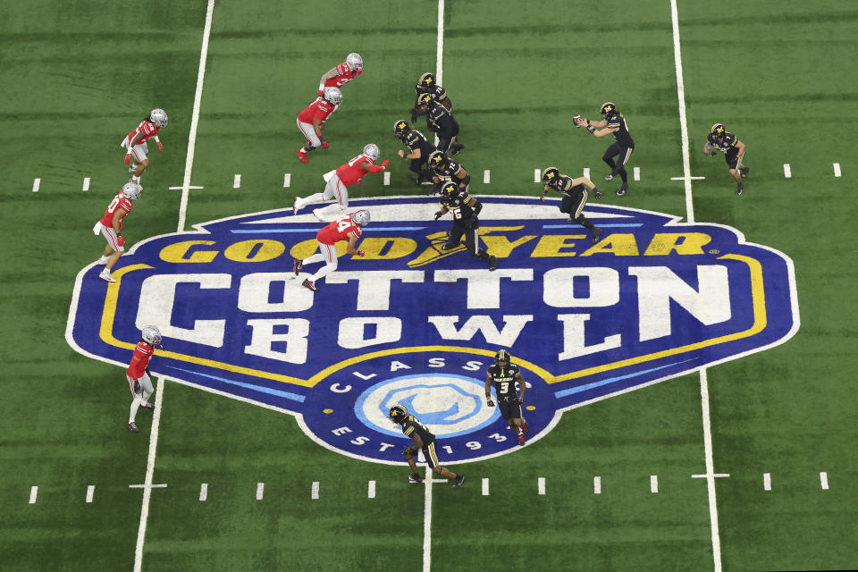 The Ohio State defense, left, faces the Missouri offense during the first half of the Cotton Bowl NCAA college football game Friday, Dec. 29, 2023, in Arlington, Texas. (AP Photo/Richard W. Rodriguez)