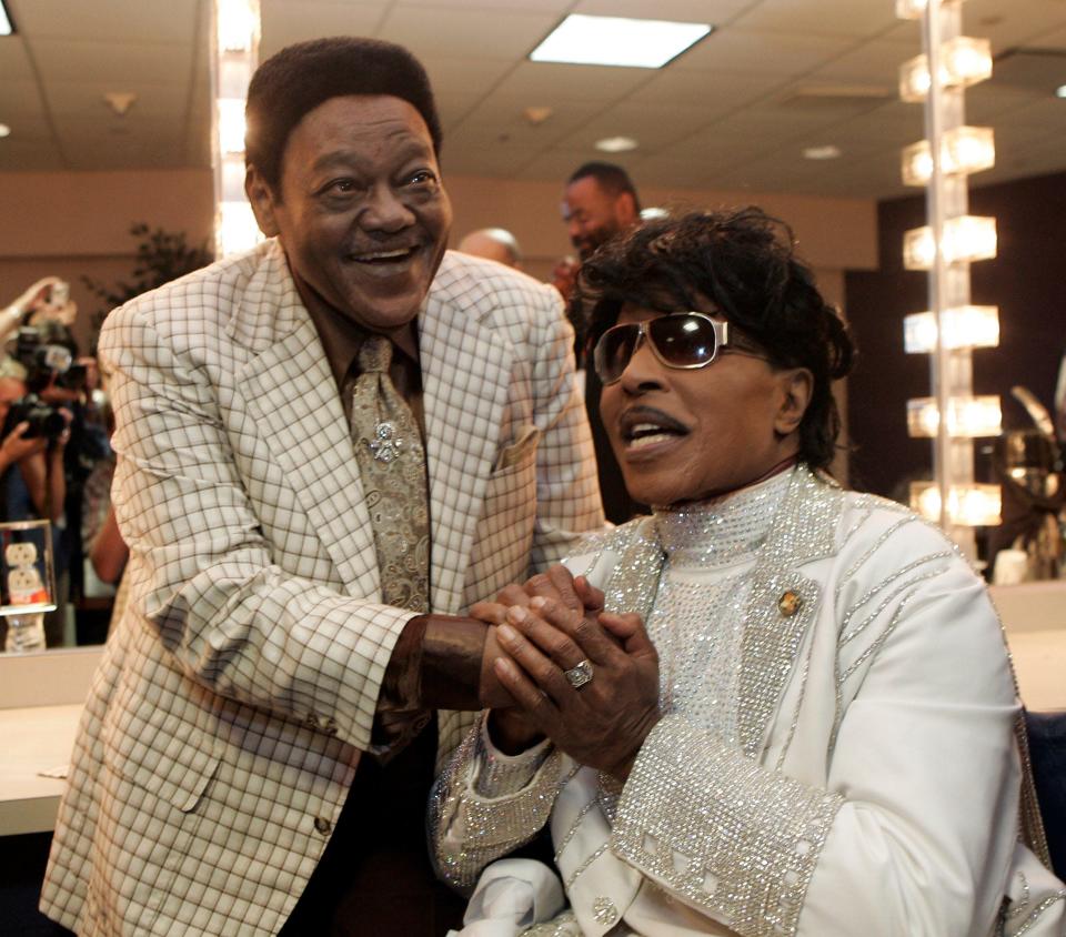 Fats Domino visits with Little Richard after a tribute concert for Domino in 2009.