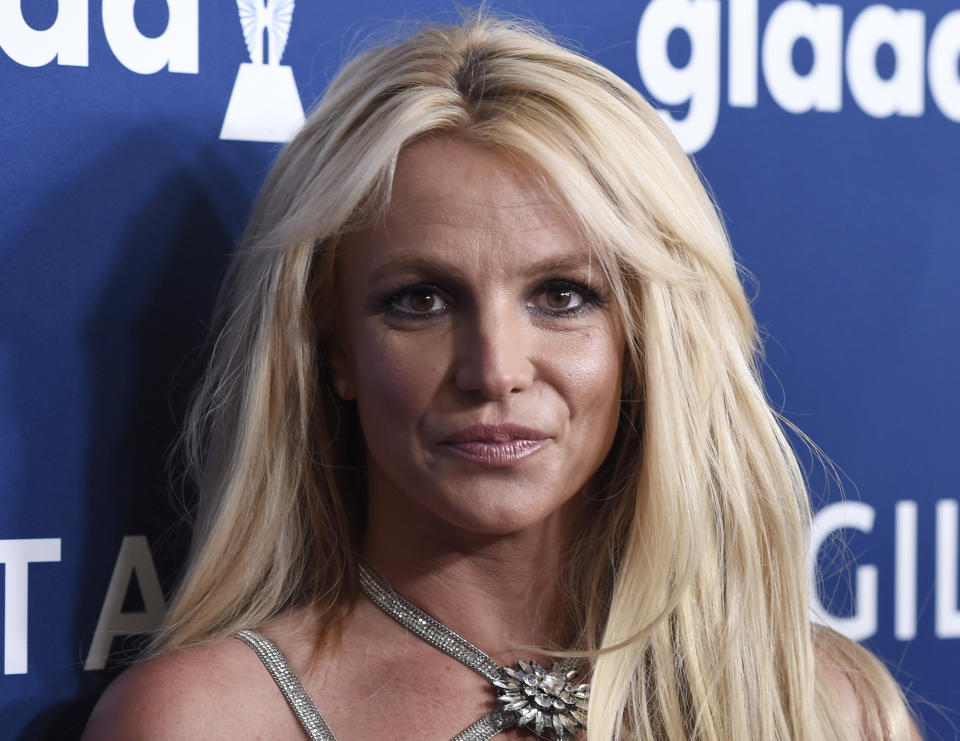 FILE - In this April 12, 2018 file photo Britney Spears arrives at the 29th annual GLAAD Media Awards, in Beverly Hills, Calif. Spears' fight to end the conservatorship that controlled vast aspects of her life is putting the spotlight on ongoing efforts in U.S. states to reform laws that advocates say too often harm the very people they were meant to protect. (Photo by Chris Pizzello/Invision/AP, File)