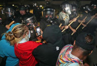 Aug 23, 2020; Kenosha, WI, USA; Police in riot gear confront protestors outside the Kenosha Police Department in Kenosha on Sunday, Aug. 23, 2020. Kenosha police shot a man Sunday evening, setting off unrest in the city after a video appeared to show the officer firing several shots at close range into the man's back. Mandatory Credit: Mike De Sisti/Milwaukee Journal Sentinel via USA TODAY NETWORK/Sipa USA