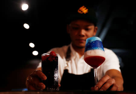 Cocktails "Kim" and "Trump", special drinks offered at Escobar bar to mark the summit meeting between U.S. President Donald Trump and North Korean leader Kim Jong Un, are prepared by a bartender in Singapore June 4, 2018. REUTERS/Edgar Su