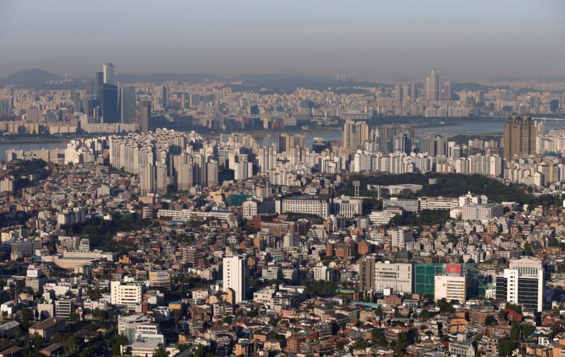 FILE PHOTO: The skyline of central Seoul is seen during sunrise in Seoul