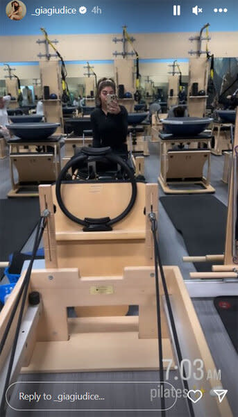 Gia Giudice standing in a pilates studio.