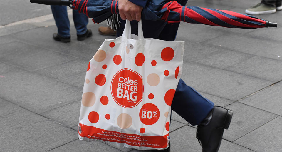 A shopper is seen carrying a reusable plastic bag at a Coles Sydney CBD store, Sydney, Monday, July 2, 2018.