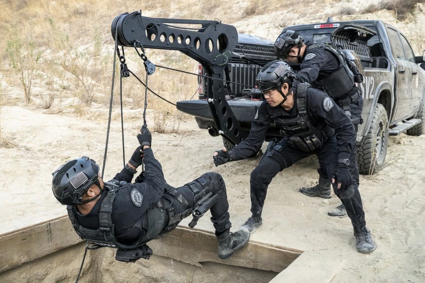 S.W.A.T. -- CBS TV Series, "Buried" – As the SWAT team helps the LAPD search for the prime suspect in a woman's disappearance, they're joined in the field by a new team member, tactical medic Nora Fowler (Norma Kuhling). Also, the personal strain between Chris and Street comes to a head as both await Hicks' decision on who the winner is of a prestigious leadership competition, on S.W.A.T., Wednesday, March 3 (10:00-11:00 PM, ET/PT) on the CBS Television Network. Pictured (L-R): Shemar Moore as Daniel "Hondo" Harrelson and David Lim as Victor Tan. Photo: Bill Inoshita/CBS ©2020 CBS Broadcasting, Inc. All Rights Reserved. Shemar Moore, left, and David Lim in "S.W.A.T." on CBS.