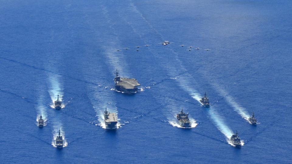Australian, U.S. and Japanese naval ships take part in a trilateral exercise July 21 in the Philippine Sea.