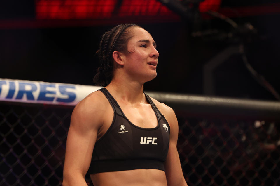 Dec 3, 2022; Orlando, Florida, USA; Yazmin Jauregui (red gloves) reacts after the fight against Estela Nunes (blue gloves) during UFC Fight Night at Amway Center. Mandatory Credit: Nathan Ray Seebeck-USA TODAY Sports