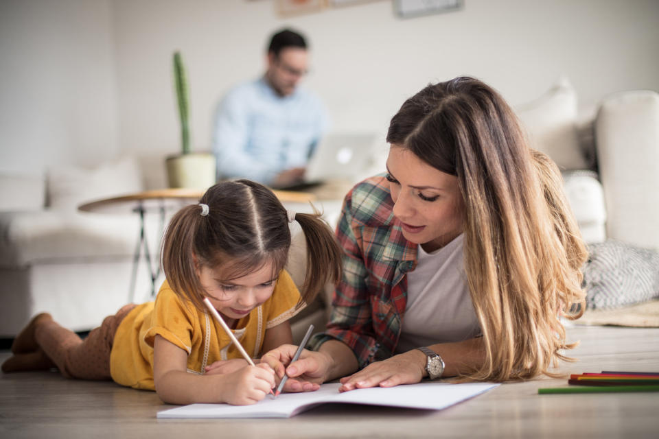 a mom helping her kid with homework