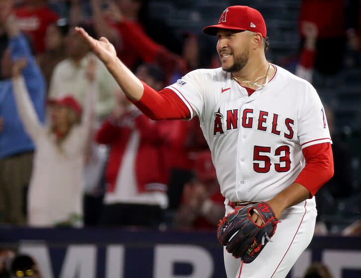 Anaheim, CA - April 25: Angels closer Carlos Estevez celebrates after retiring the Athletics in order to end the game.