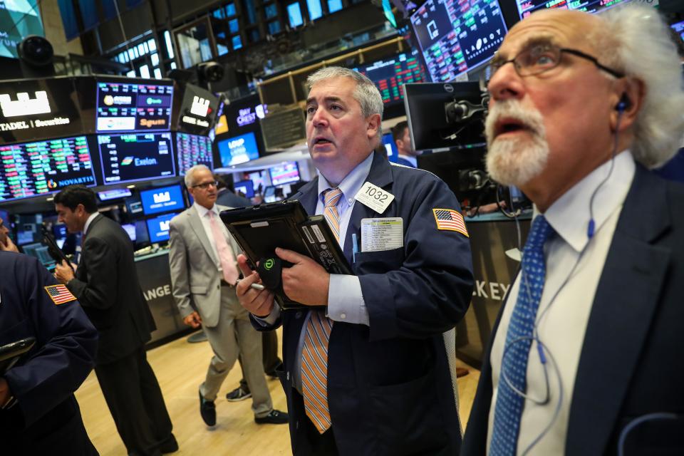 Stock traders on the exchange trading floor.