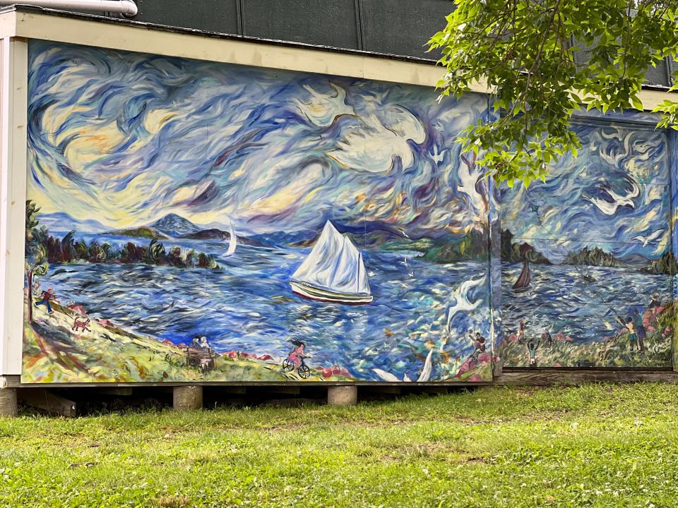 A swirly mural from 2004 that depicts lake recreation adorns Perkins Pier in Burlington, as seen on August 3, 2023.