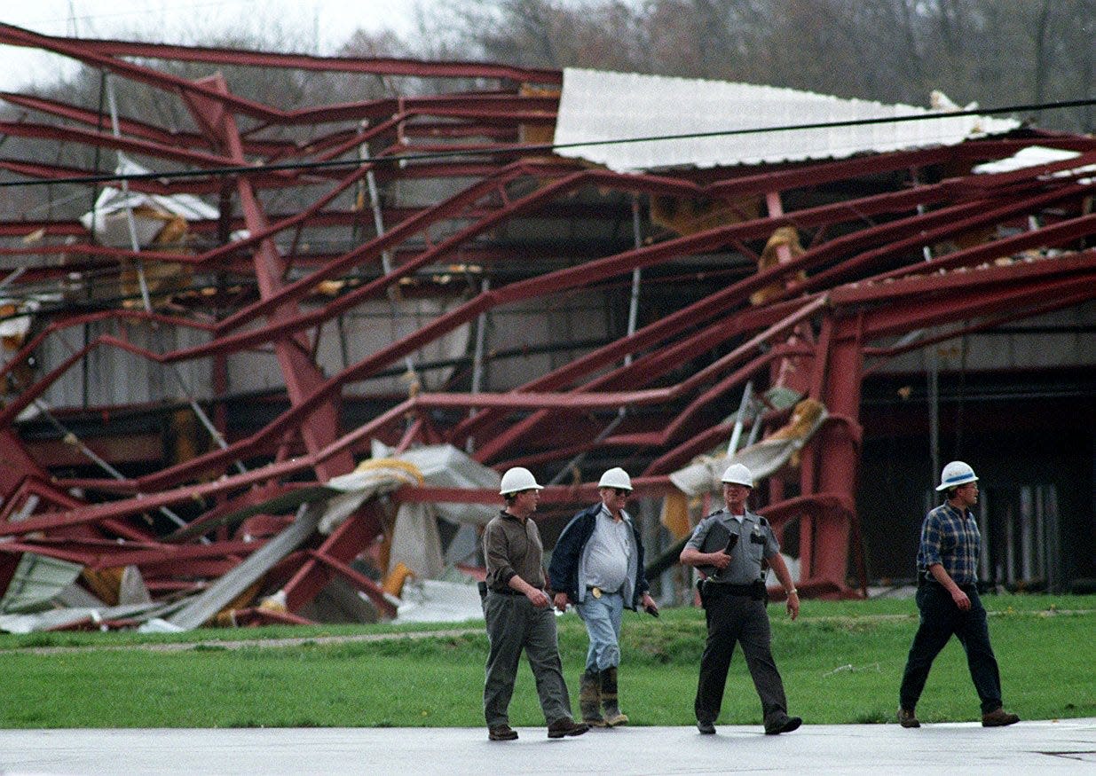 Police and building inspectors evaluate buildings in the Blue Ash Industrial Park destroyed and left untouched by the tornado that hit April 9, 1999.
