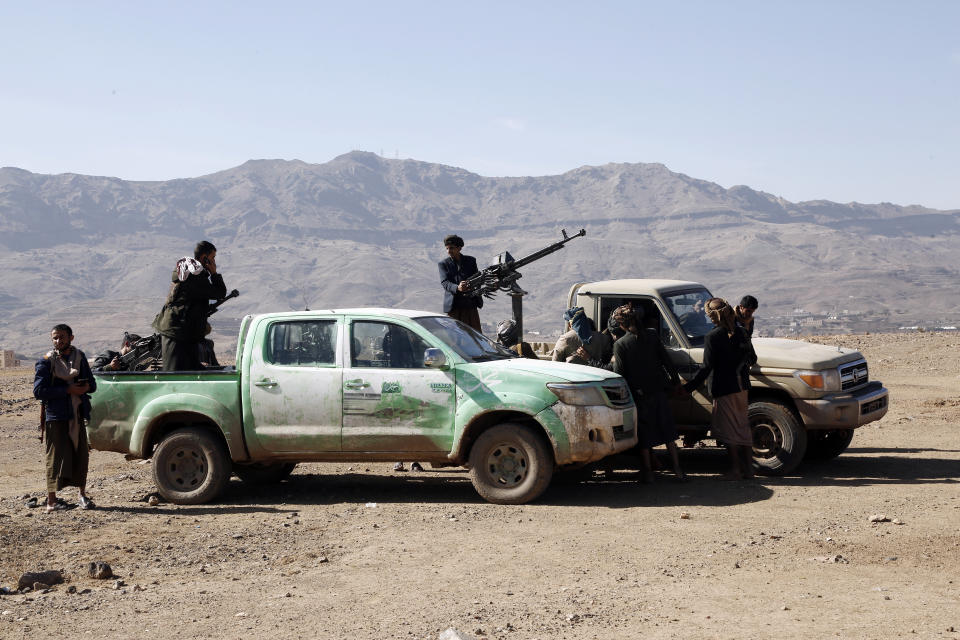 SANA'A, YEMEN - JANUARY 22: Houthi fighters manning machine guns mounted on vehicles during a tribal parade held against the United States-led aerial attacks launched on sites in Yemen, and solidarity with Palestinians, on January 22, 2024, near Sana'a, Yemen. The Houthi-run Air forces continue launching missiles and drones at what they consider targeting ships linked to Israel or sailing to Israeli ports at the Red Sea and Bab Al-Mandb Strait, the move created a crucial maritime crisis, which was followed by the creation of a military coalition by the United States in an attempt to deter attacks on international shipping in the Red Sea, although the reiterated Houthis declarations that all that they target only are the ships that owned or linked to Israel ships. (Photo by Mohammed Hamoud/Getty Images)