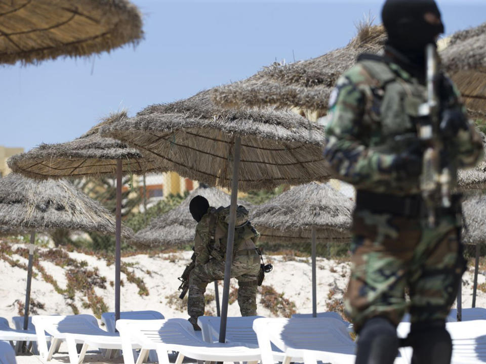 Masked Tunisian soldiers stand guard on the beach at the Riu Imperial Marhaba Hotel in Port el Kantaoui, on the outskirts of Sousse after a terrorist attack in June: AFP