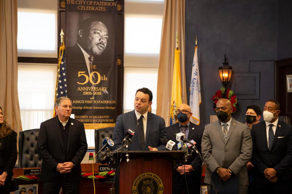 Paterson Mayor Andre Sayegh, center, and NJ's Urban Mayors Association along with law enforcement officials and NJ State Legislators hold a press conference to announce a proposed bill that is supposed to prevent individuals charged with gun crimes from being released prior to the disposition of the charges in Paterson, N.J. on Tuesday Feb. 8, 2022. 