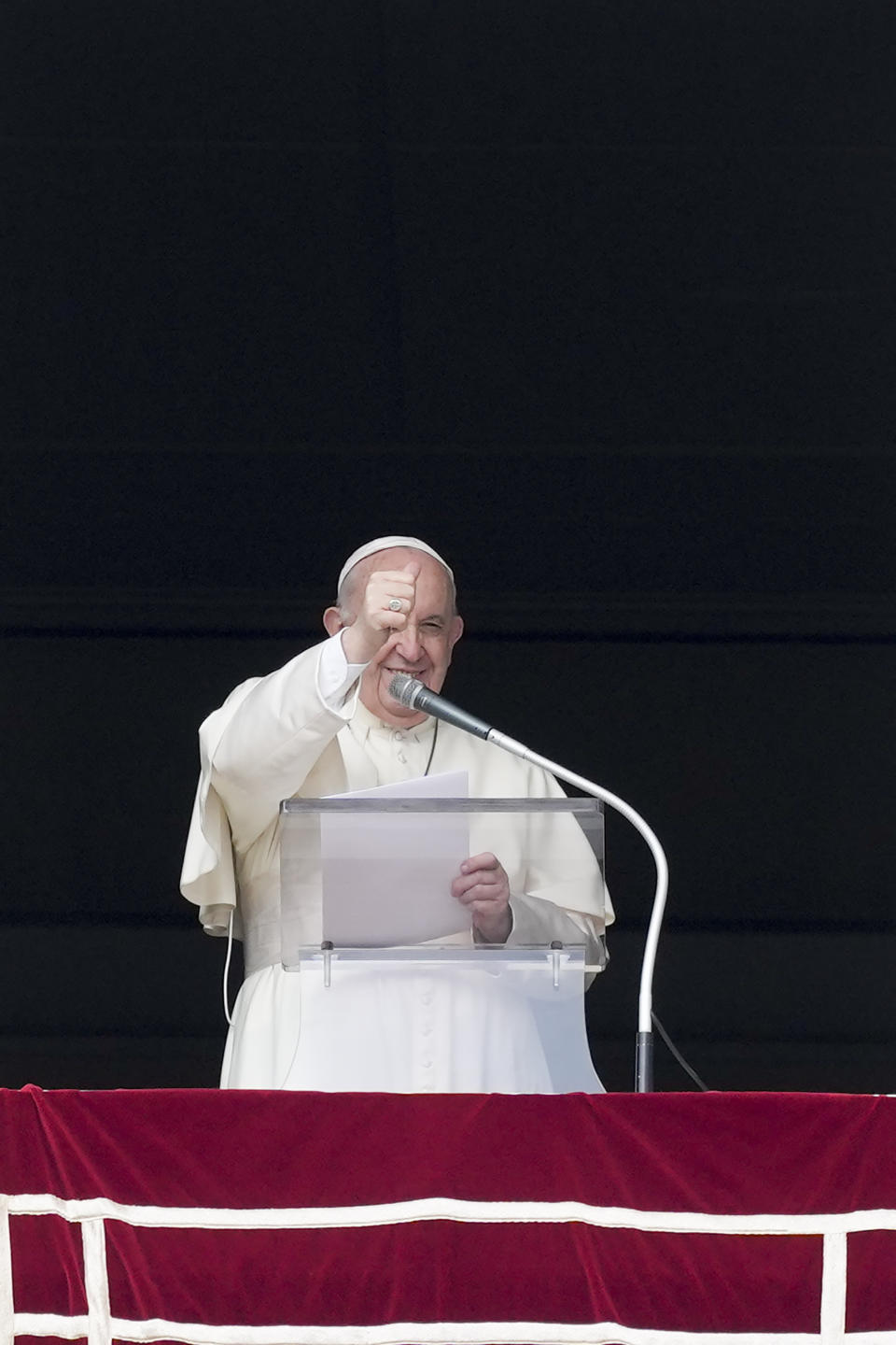 Pope Francis givers his thumbs up as he leaves after the Angelus noon prayer from the window of his studio overlooking St.Peter's Square, at the Vatican, Sunday, Oct. 3, 2021. (AP Photo/Alessandra Tarantino)