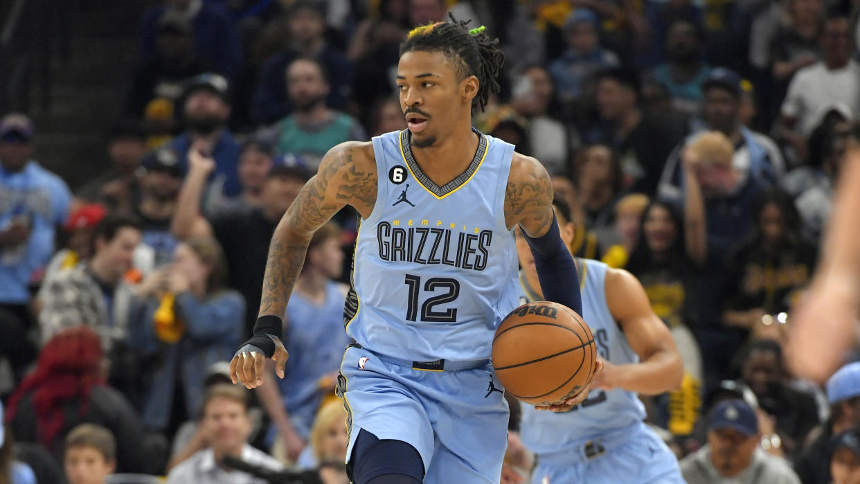 Memphis Grizzlies guard Ja Morant (12) brings the ball up court during the first half of Game 5 in a first-round NBA basketball playoff series against the Los Angeles Lakers Wednesday, April 26, 2023, in Memphis, Tenn. (AP Photo/Brandon Dill)