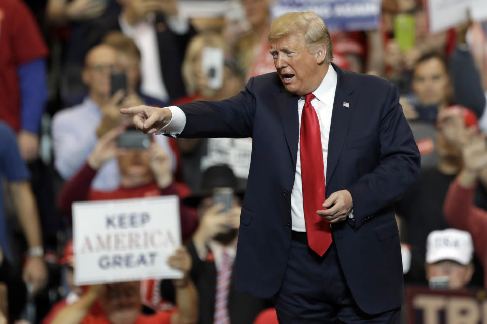 President Donald Trump acknowledges his supporters after speaking at a campaign rally, Monday, Nov. 5, 2018, in Cleveland. (AP Photo/Tony Dejak)