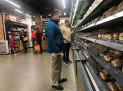 Customers browse packaged wraps, sandwiches and salads at Amazon's new "grab-and-go" store in Seattle, Washington, U.S., January 18, 2018. Photo taken January 18, 2018. REUTERS/Jeffrey Dastin