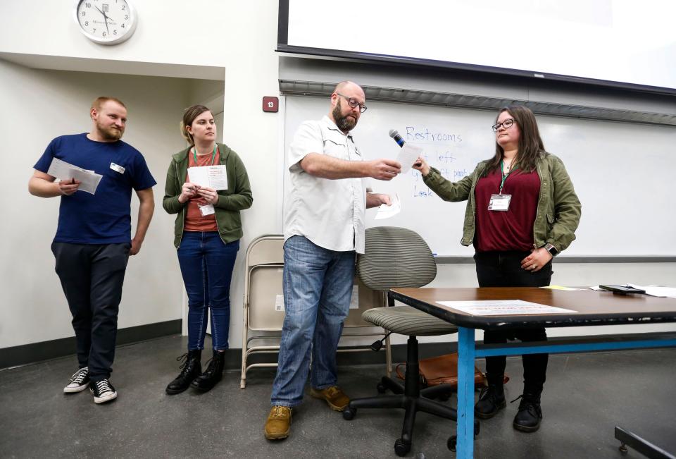 Joshua Moss with The Kitchen takes part in a poverty simulation at the Missouri State University Community Conference on Poverty on Friday, April 26, 2024.