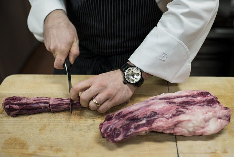 Chef Richard Rosendale cuts an ox tail in The Bunker's cafeteria kitchen, below the Greenbrier Resort in White Sulphur Springs, West Virginia, on January 10, 2013. Rosendale, who runs the Greenbrier Resort's food operations including its 13 restaurants, and Commis Corey Siegel will represent the US in the 2013 Bocuse D'Or, a biennial world chef championship in Lyon, France, end of January